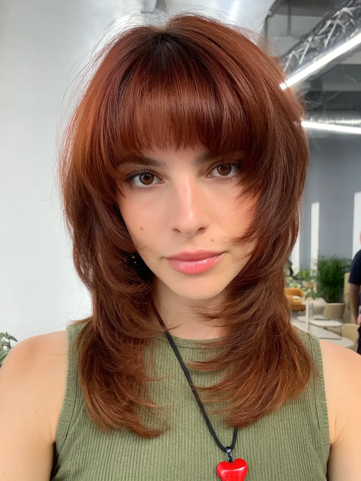 Shoulder-Length Copper Brown Layered Shag with Blunt Bangs